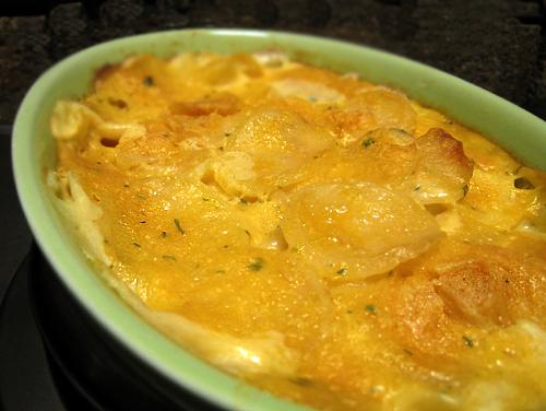 Cheesy Scalloped Potatoes. Photo by Caroline Cooks