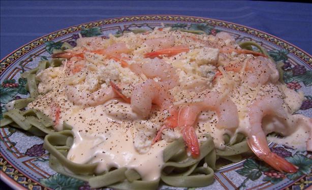 Shrimp Fettuccine Alfredo over Spinach Noodles. Photo by lazyme