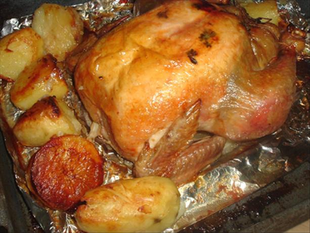 Onion Stuffed Roast Chicken With Potatoes. Photo by Bergy
