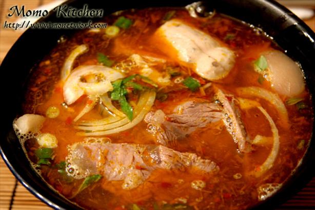 Bun Bo Hue (Spicy Hue Style Noodle Soup With Lemongrass). Photo by guppymo