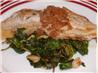 Pan Fried Tilapia With Lime Basil Beurre Blanc on a Bed of Wilt. Recipe by Tasty Tidbits