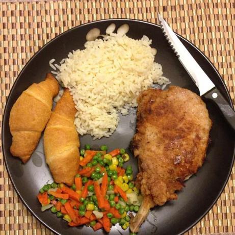 My Dad Swears My Sister Makes the Best Pork Chops in the World. Photo by qbraid