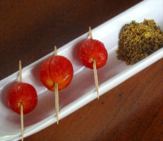 Cherry Tomatoes Marinated in Vodka (In Oversized Martini Glass). Photo by Caroline Cooks