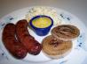Brats With Glazed Red Onions