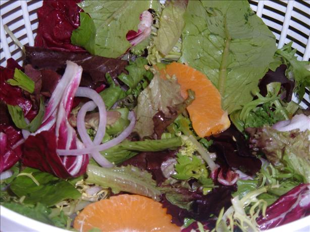 Emeril's Spinach, Orange and Candied Almond Salad. Photo by Kay Demonbren