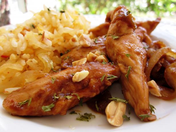 Sriracha-Glazed Chicken and Onions over Long-Grain Rice. Photo by gailanng