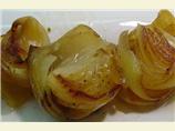Roasted Onions on a Bed of Herbs