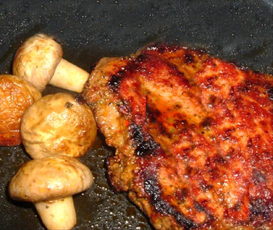 Grilled Maple Chipotle Pork Chops on Smoked Gouda Grits. Photo by Bergy