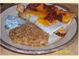 Easy Cheesy Chicken Enchiladas With Yogurt Sauce. Photo by ShortyBond