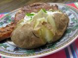 Baked Potatoes in Their Jackets With Sour Cream Topping