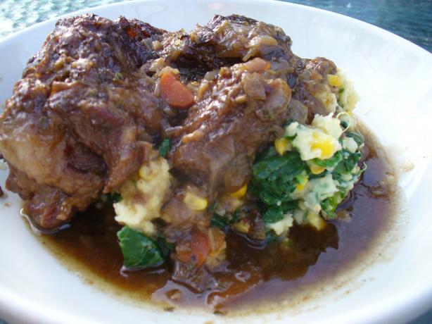 Smothered Oxtails over Spinach and Sweet Corn Mash. Photo by IngridH