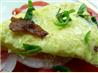 Scrambled Eggs over Fresh Sliced Tomatoes and Basil