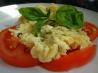 Scrambled Eggs over Fresh Sliced Tomatoes and Basil
