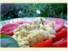 Scrambled Eggs over Fresh Sliced Tomatoes and Basil