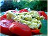 Scrambled Eggs over Fresh Sliced Tomatoes and Basil