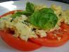 Scrambled Eggs over Fresh Sliced Tomatoes and Basil