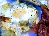 Baked Eggs on a Bed of Potatoes With Bacon