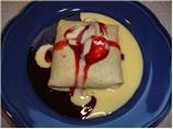Three Berry Crepes with Creme Anglaise and Strawberry Sauce
