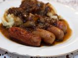 Sausages With Mashed Potatoes, Beer and Onion Gravy and Mustard