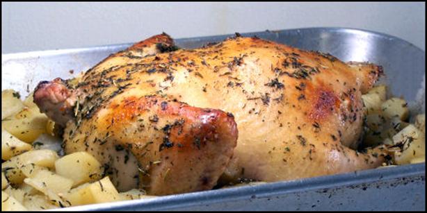 Roast Chicken Stuffed with Herbed Potatoes. Photo by kzbhansen