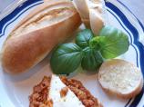 Queso De Cabra Con Tomate (Goat Cheese Baked in Tomato Sauce)
