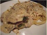 Basil Pesto Stuffed Chicken Breasts With Sun-Dried Tomato Cream. Photo by Grimm's Restaurant Tales