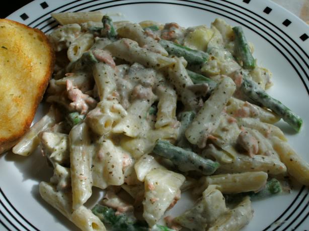 Salmon Penne With Basil Pesto Cream Sauce, Artichokes, and Asparagus. Photo by sweetcakes