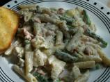 Salmon Penne With Basil Pesto Cream Sauce, Artichokes, and Asparagus