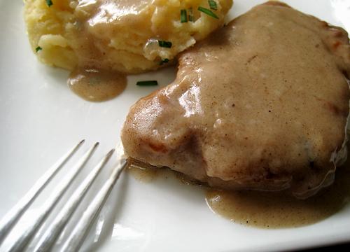 Country Fried Pork Chops With Cream Gravy. Photo by Caroline Cooks