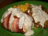 Stuffed Chicken Wrapped in Bacon Served With Gravy