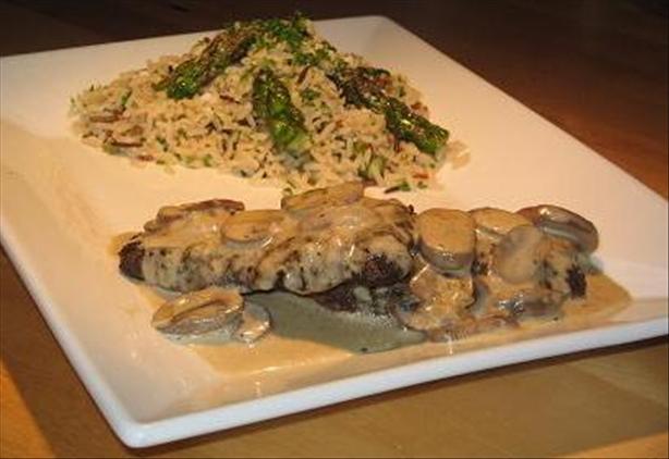 Ostrich Steaks With Mushroom Vanilla Sauce and Wild Rice With As. Photo by The Flying Chef