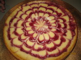 Vanilla Cheesecake With Chocolate Hazelnut Crust and Raspberries