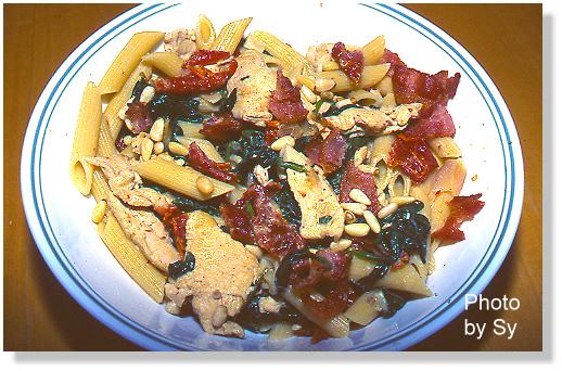 Pasta With Chicken, Spinach, Pine Nuts, Bacon And. Photo by Skipper/Sy