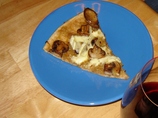 Roasted Garlic, Caramelized Onions, Mushrooms, and Brie Pizza
