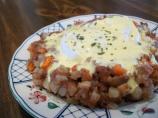 Corned Beef Hash With Poached Eggs Under Hollandaise