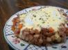 Corned Beef Hash With Poached Eggs Under Hollandaise. Recipe by 2Bleu