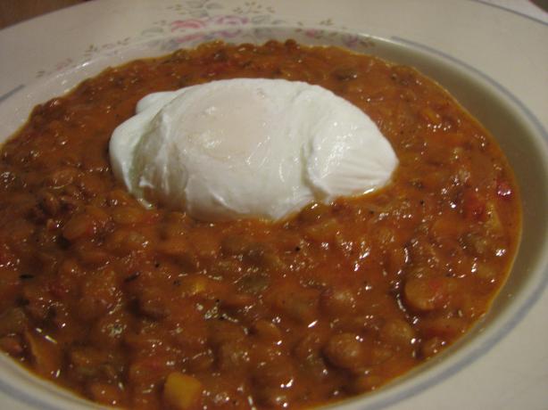 Poached Eggs With Slow Cooked Spicy Lentils. Photo by Elmotoo