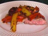 Steak Topped With Peppers and Onions