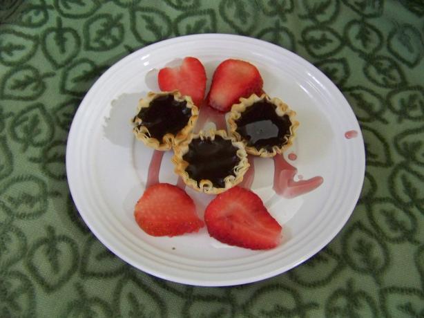 Warm Chocolate Tart With Red Wine Sauce. Photo by invictus