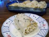 Chicken and Cheese Rotolo With Many Cloves Garlic Sauce