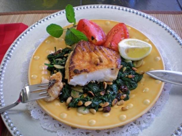 Sea Bass on Spinach With Raisins and Pine Nuts. Photo by gemini08