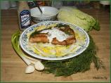 Salmon With a Creamy Sauce on a Bed of Greens