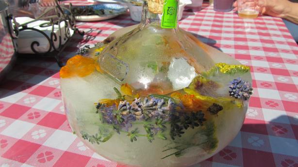 Frozen Festive Vodka or Tequila Bottles With Herbs and Berries. Photo by Rita~