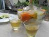 Frozen Festive Vodka or Tequila Bottles With Herbs and Berries