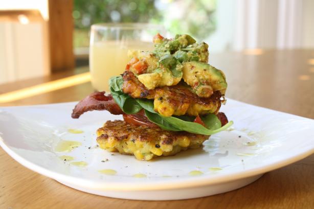 Corn Fritters With Crispy Bacon, Roasted Tomatoes & Avocado. Photo by gourmet_lovers