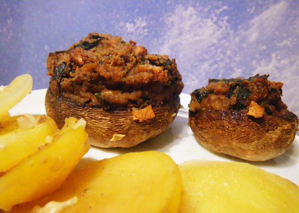Stuffed Champignons on Potatoes Bed. Photo by awalde