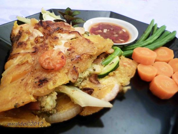 Vietnamese Chicken Pancakes With Shrimps (Bhan Ga). Photo by awalde