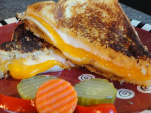 Four Grilled Cheese Sandwich With Onions. Photo by Muffin Goddess
