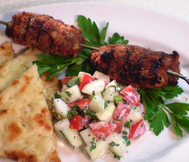 Cucumber and Tomato Salad in Garlic Yogurt Dressing. Photo by TasteTester