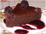 Decadent Chocolate Cake on a Bed of Raspberry Sauce